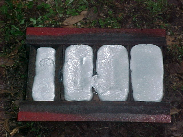 ingots from old pop cans in the mold